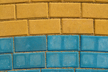 yellow and blue paving tiles for background or texture