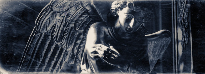 Angel. Ancient statue. Retro filter and vintage style.