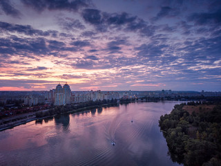 Purple sunset over Sobache hyrlo bay in Obolon district of Kyiv, Ukraine