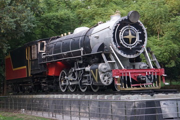 Naklejka premium the Vintage Steam rail engine situated in a public park for show