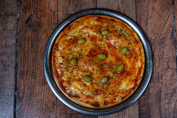 pizza de muzzarella y oregano