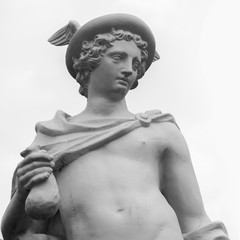 Ancient statue of the antique god of commerce, merchants and travelers Hermes (Mercury). He is...
