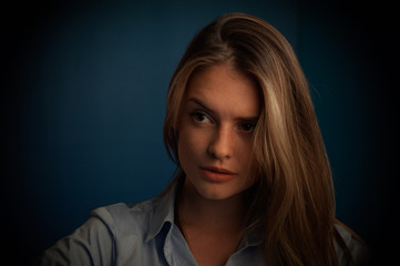 portrait of fashion model beautiful girl with freckles in studio, close up, beautiful girl young woman