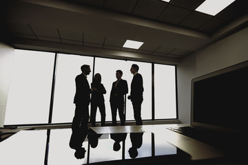 Silhouette of young business people in the office.