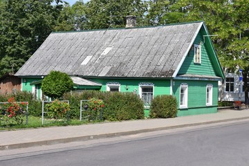 Lithuania, Vilnius - July 2019. Houses Trakai on Lake Galve in Lithuania. Beautiful bright wooden house in Trakai city. Traditional karaim house with wooden panel on front. Colorful houses 