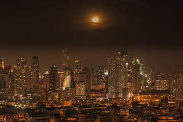 Manila skyline at night with moon