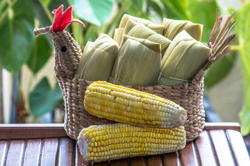 Pamonha. Brazilian Corn Snack on chicken basket