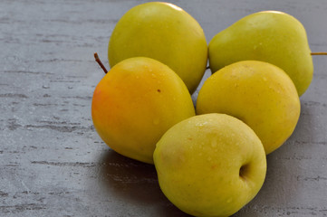 Fresh yellow apples. Wash apples in water.