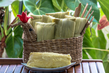 Pamonha. Brazilian Corn Snack on chicken basket