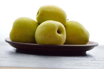 Fresh yellow apples. Wash apples in water.