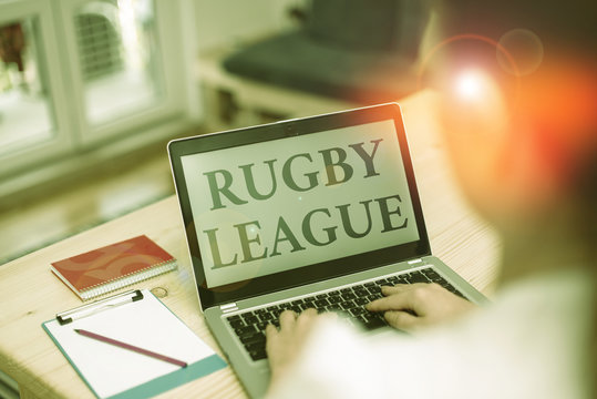 Handwriting text Rugby League. Conceptual photo form of rugby football played between teams of 13 players woman laptop computer office supplies technological devices inside home