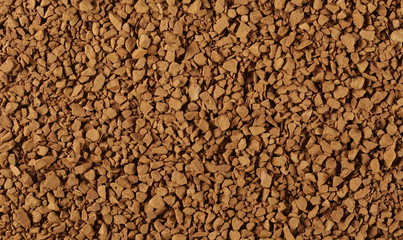 Instant coffee granules background and texture