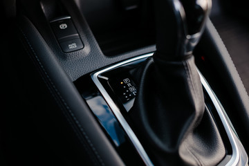 Obraz premium Automatic gear stick of a modern car. Automatic transmission lever shift.