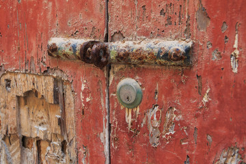 Brown orange rusty old door handle and lock