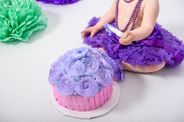 crashed party background - smashed cake over brick wall with lights and colorful balloons