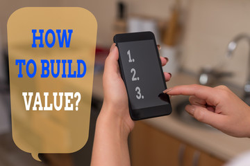 Writing note showing How To Build Value Question. Business concept for Ways for developing growing building a business woman using smartphone and technological devices inside the home