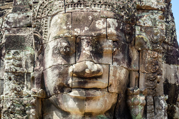 Siem Reap / Cambodia - May 27 / 2019 : huge buddha heads statues at bayon temple at angkor wat temple complex