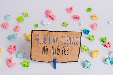Text sign showing Hello I Am Turning No Into Yes. Business photo text Persuasive Changing negative into positive Colored crumpled papers empty reminder white floor background clothespin
