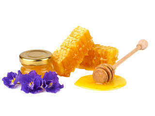 Honey and honeycomb isolated on a white background
