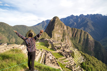 Traveller at the Lost city of the Incas, Machu Picchu,Peru on top of the mountain, with the view panoramic.