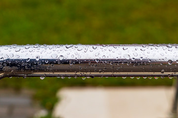 street lighting. it's raining. metal perryl in drops of water