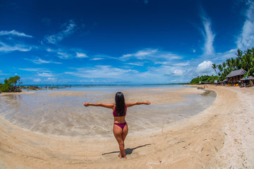 Fototapeta na wymiar Young woman on the beach at Morro de Sao Paulo in Bahia Brazil