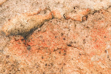 Old granite wall background and texture, close-up.