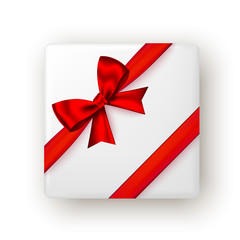 Gift box with red ribbon and bow, top view.