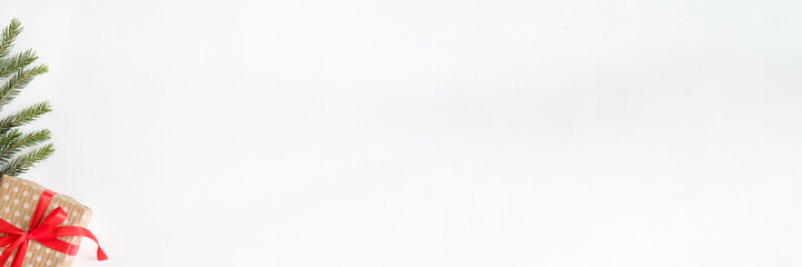 Winter holidays background. Present greeting. Gift box fir tree decor on white.