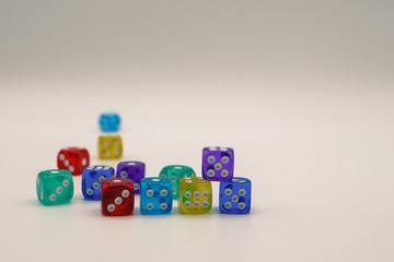 Colorful geometric shapes with number pattern laying on white background. Small square cubes forming wall with blocks. abstract cubes falling down, 4K video 