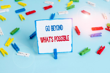 Conceptual hand writing showing Go Beyond What S Possible. Concept meaning do bigger things You can reach dreams Colored clothespin papers empty reminder blue floor officepin