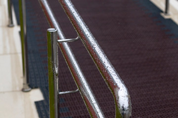 street lighting. it's raining. metal perryl in drops of water