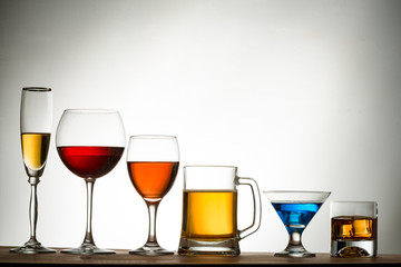 assortment of alcoholic beverages and glasses