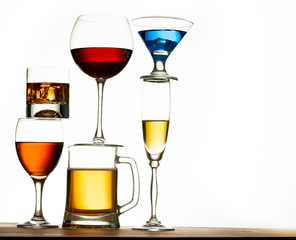 assortment of alcoholic beverages and glasses