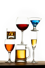 assortment of alcoholic beverages and glasses