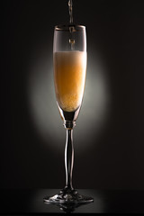 glass of champagne in the dark