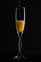 glass of champagne in the dark