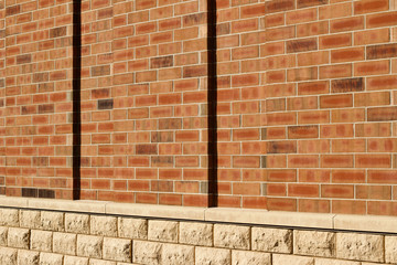 Orange color brick wall texture with 1/3 offset stagger brickwork pattern (angle view)