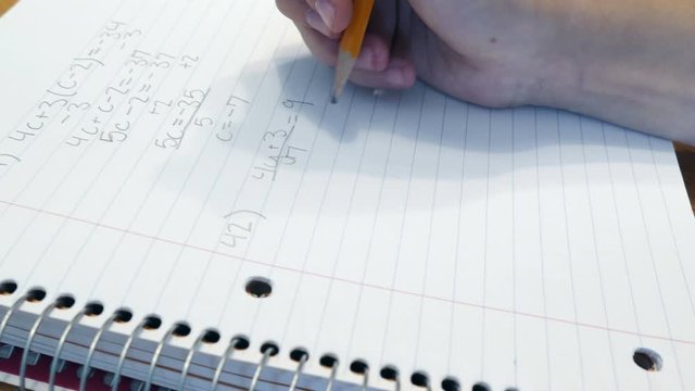 4K: Teen Girl Doing Algebra Homework