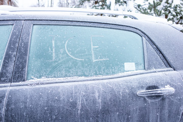 Frozen black car side  window with ICE text