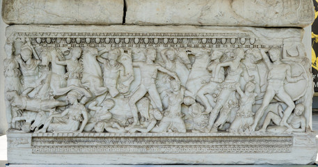 Ancient stone sarcophagus with battle scenes at the entrance of the Archaeological Museum of Thessaloniki Soldiers in battle Scene from foot of sarcophagus ancient macedonia greece