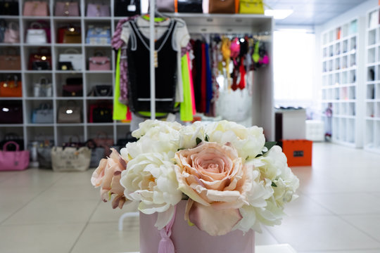 The wardrobe fashion clothes of various brands. Сloset in which everything put in order. All things are folded neatly. Everything is in its place. Harmony. Showroom. 