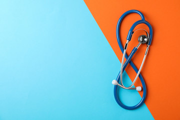 Stethoscope on two tone background, space for text. Healthcare