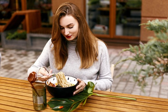 Young European Girl Eating Ramen