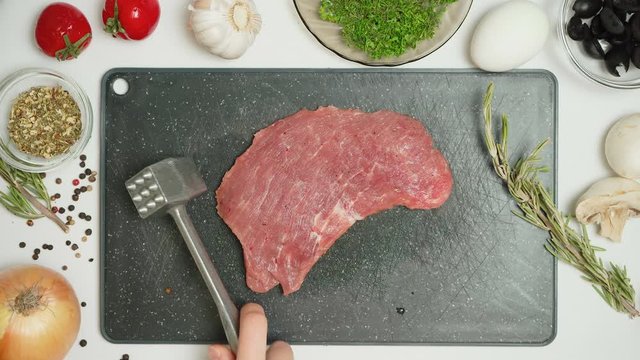 Video of spicy meat and tenderizer in the kitchen