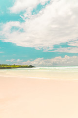 Tropical beach with turquoise ocean waves and white sand. Holiday, vacation, paradise, summer...