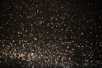 light sparkles on dark background, snow immitaton