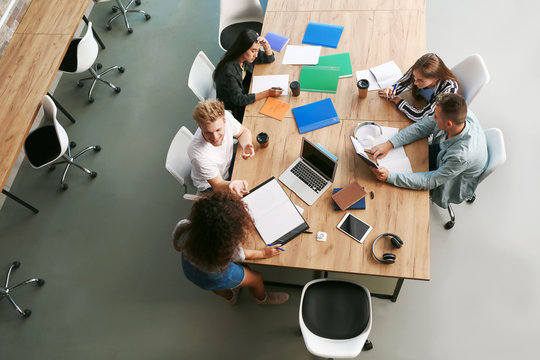 Group Of Students Preparing For Exam In University, Top View