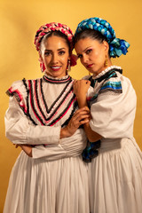 Mexican adelitas Young gay couple lesbian love hug  culture costume typical white