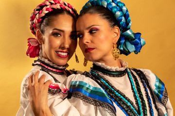 Mexican adelitas Young gay couple lesbian love hug  culture costume typical white